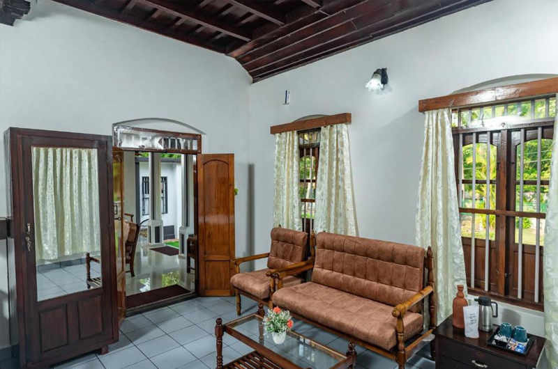 Spacious hall area of Babira Brookside Heritage Resort Kumarakom with heritage décor