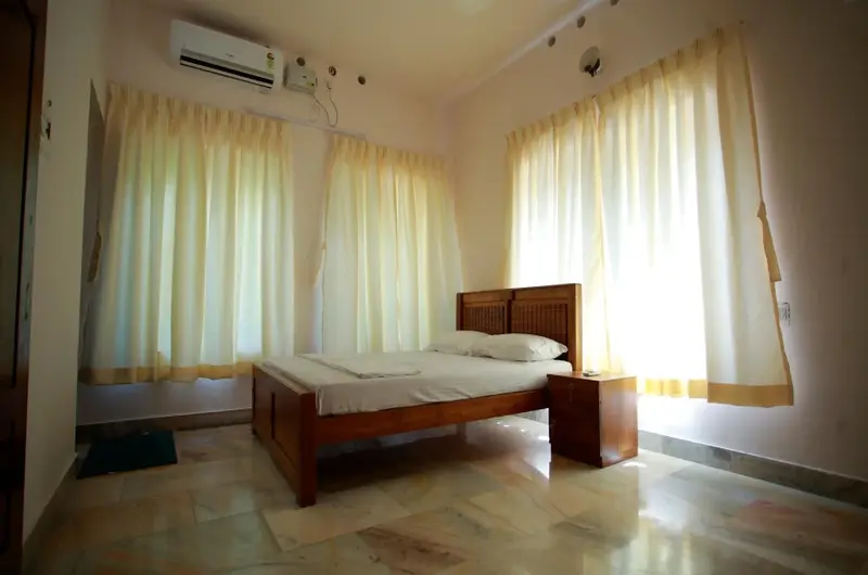 green-nestle-heritage-homestay-kumarakomComfortable traditional bedroom at Green Nestle Heritage Kumarakom