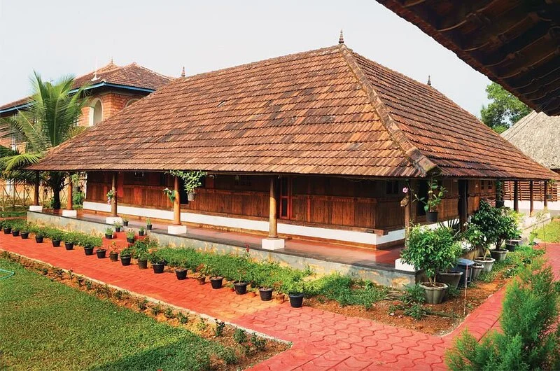 Side heritage view of Kumarakom Heritage Resort – traditional Kerala architecture