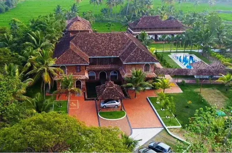 Aerial drone view of Kumarakom Heritage Resort – luxury lakeside resort in Kerala