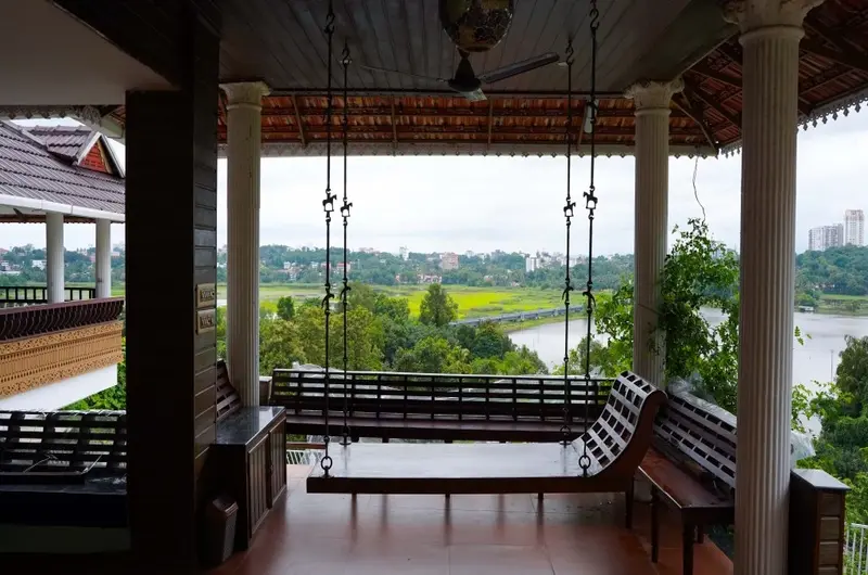 Heritage sit-out overlooking Kumarakom backwaters at Lakshmipuram Palace Kumarakom
