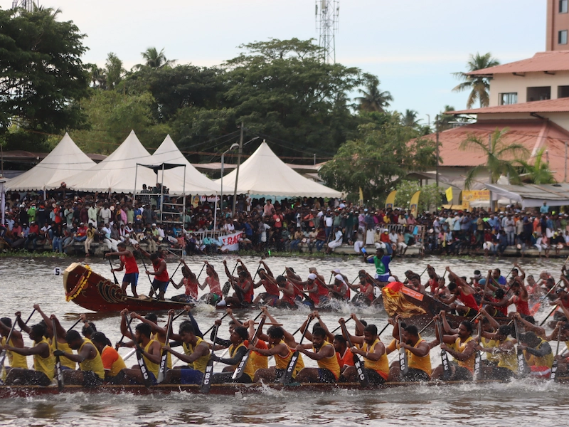Traditional snake boats competing at the 72nd Nehru Trophy Boat Race in Punnamada Lake Alappuzha